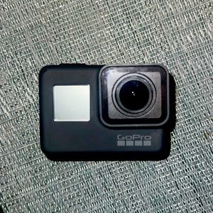 GoPro Hero5 with accessories (including charger), case, and storage bag.
